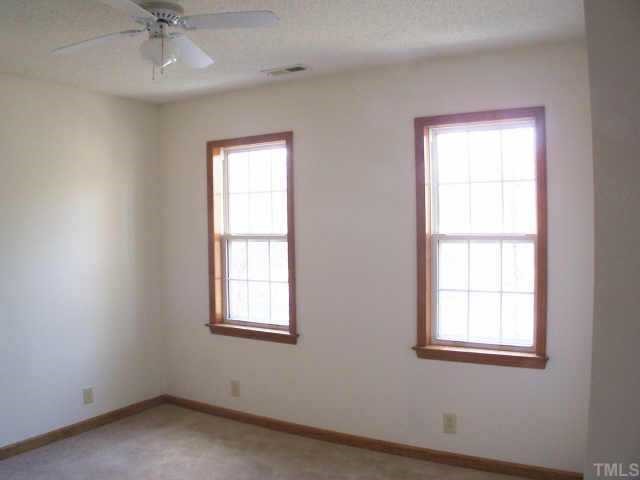 809 West C Street Butner, NC 27509 - Photo 9 of 12 an empty room with a window