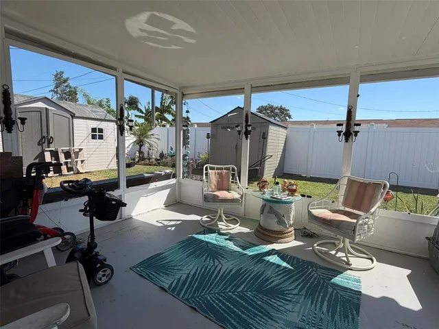 a living room with furniture a fireplace and a table