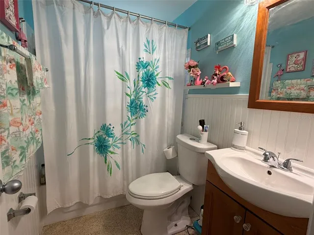 a bathroom with a toilet sink and tub