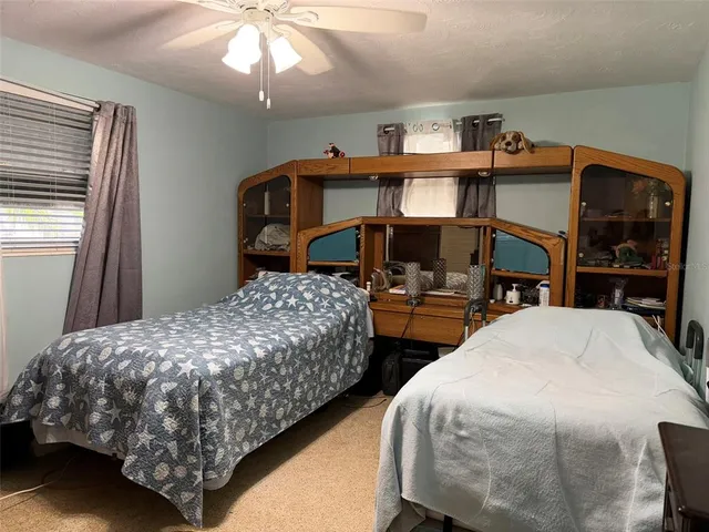 a bedroom with bed and a window