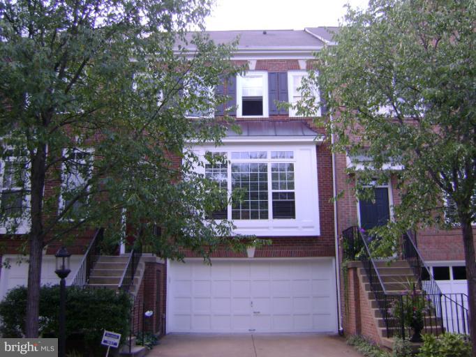 1967 Logan Manor Drive Reston, VA 20190 - Photo 1 of 30 front view of house with a yard