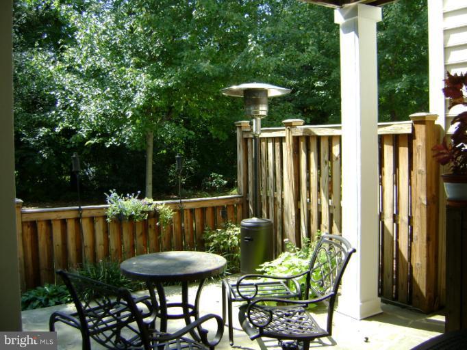 1967 Logan Manor Drive Reston, VA 20190 - Photo 12 of 30 a view of a chair and table in backyard of the house