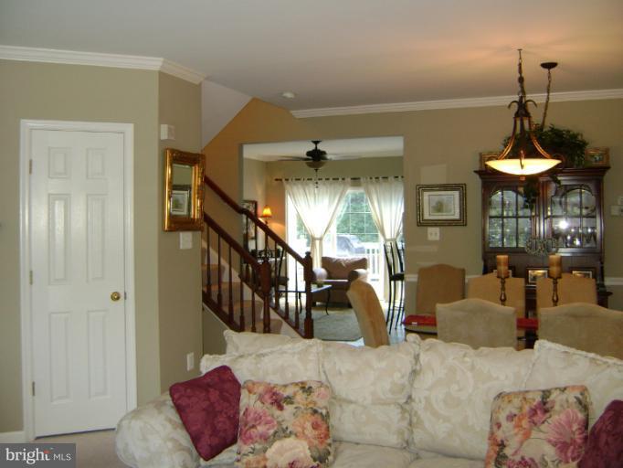 1967 Logan Manor Drive Reston, VA 20190 - Photo 14 of 30 a livingroom with furniture and a chandelier