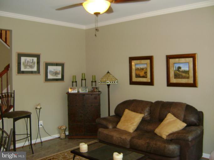 1967 Logan Manor Drive Reston, VA 20190 - Photo 16 of 30 a living room with furniture and a lamp