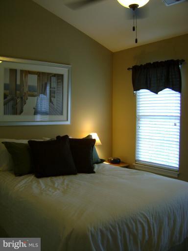 1967 Logan Manor Drive Reston, VA 20190 - Photo 18 of 30 a bedroom with a bed and window