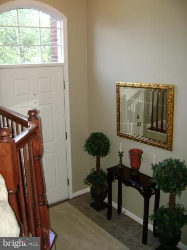 1967 Logan Manor Drive Reston, VA 20190 - Photo 20 of 30 a living room with furniture and a potted plant