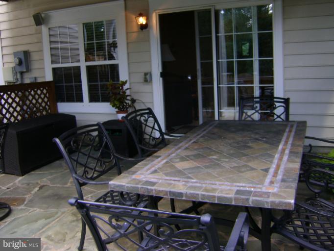 1967 Logan Manor Drive Reston, VA 20190 - Photo 22 of 30 a view of a dinning table and chair in the patio