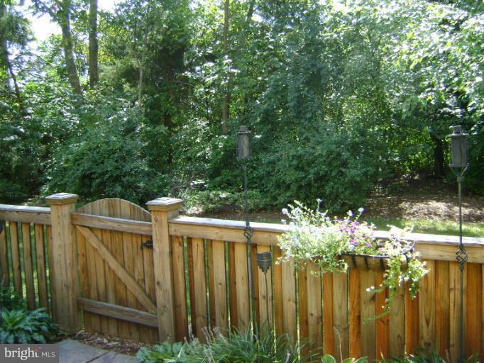 1967 Logan Manor Drive Reston, VA 20190 - Photo 24 of 30 a view of a house with a wooden fence