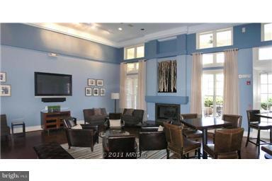 1967 Logan Manor Drive Reston, VA 20190 - Photo 28 of 30 a living room with furniture a flat screen tv and large window