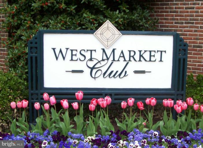 1967 Logan Manor Drive Reston, VA 20190 - Photo 30 of 30 a sign that is in front of flowers