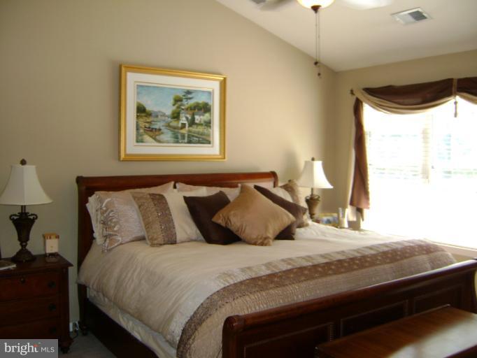 1967 Logan Manor Drive Reston, VA 20190 - Photo 4 of 30 a bedroom with a bed and a window