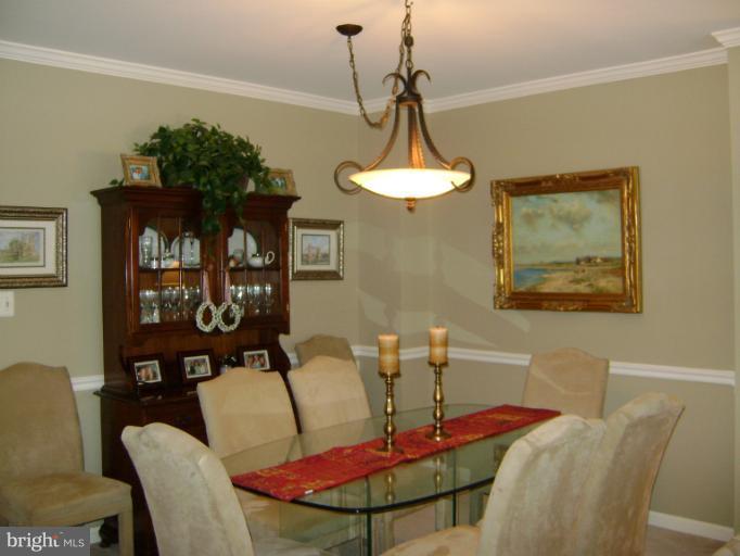 1967 Logan Manor Drive Reston, VA 20190 - Photo 6 of 30 a view of a dining room with furniture and chandelier