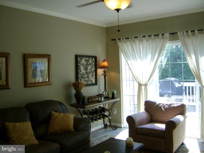 1967 Logan Manor Drive Reston, VA 20190 - Photo 8 of 30 a living room with furniture and a large window