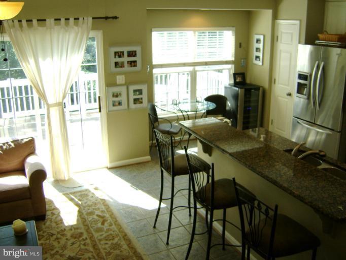 1967 Logan Manor Drive Reston, VA 20190 - Photo 10 of 30 a dining room with furniture and a window