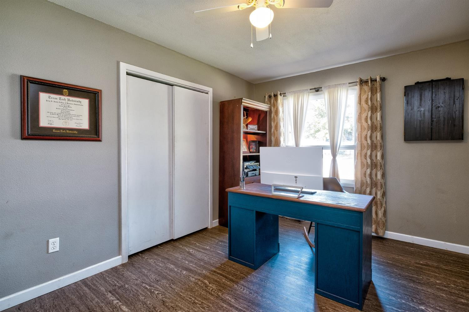 5209 16th Street Lubbock, TX 79416 - Photo 19 of 23 a view of a workspace with furniture and a window