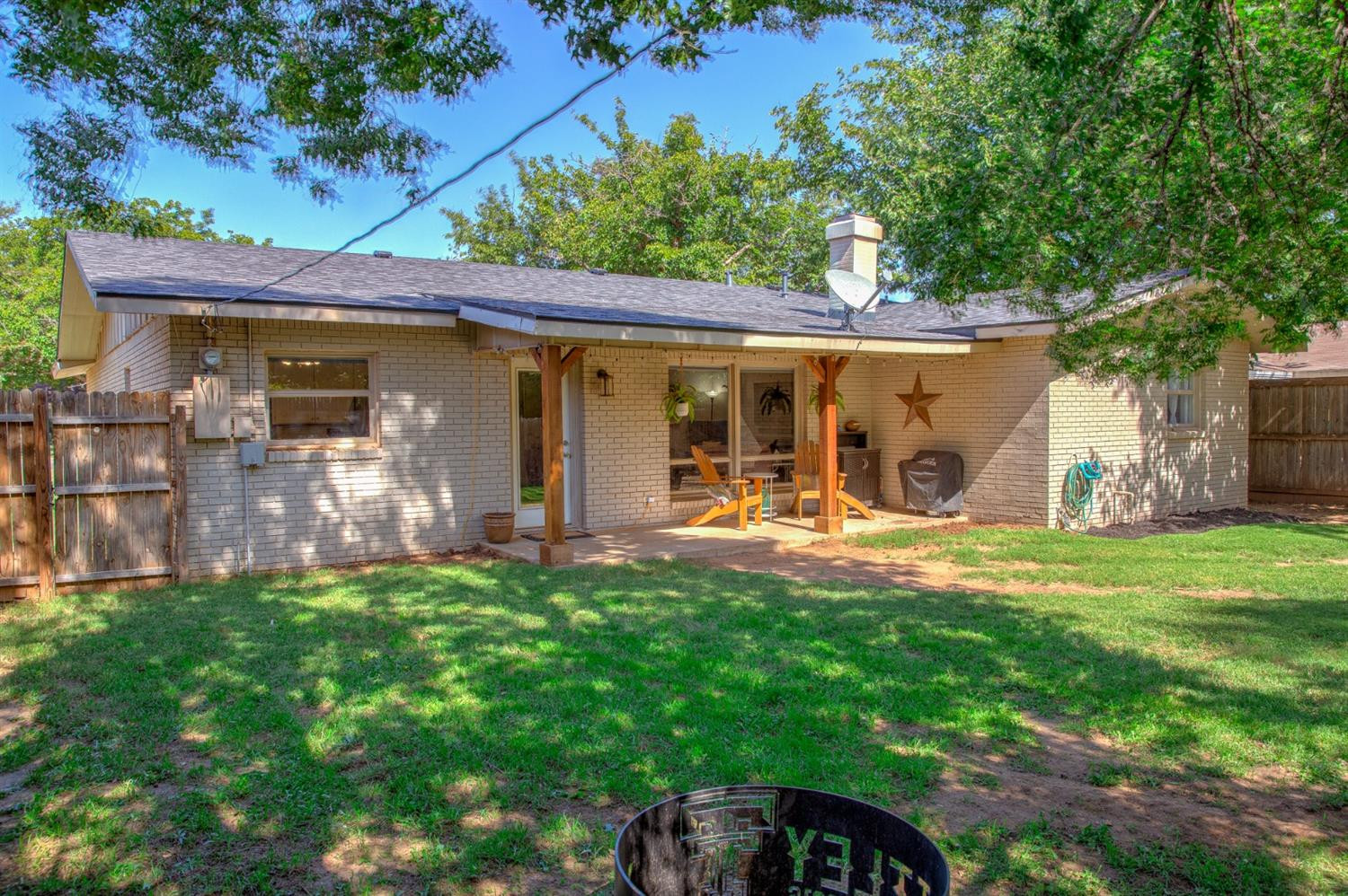 5209 16th Street Lubbock, TX 79416 - Photo 22 of 23 front view of a house with a yard