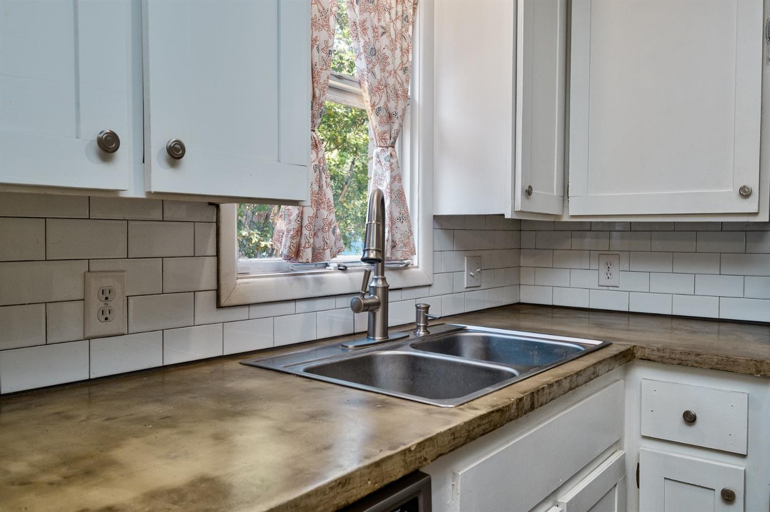 5209 16th Street Lubbock, TX 79416 - Photo 9 of 23 a kitchen with a sink and cabinets