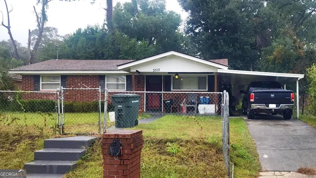 a view of a house with backyard porch and sitting area