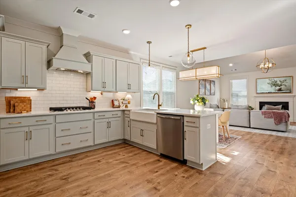 a kitchen with sink cabinets and window