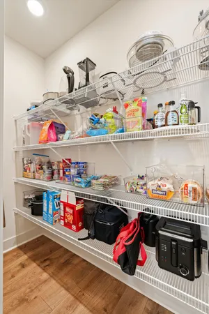 a cabinet with storage and utility room