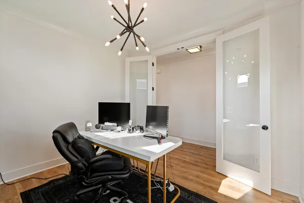 a view of a workspace with furniture