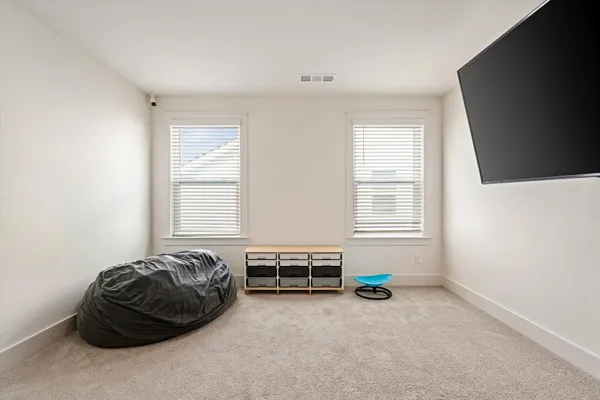 a room with a bed and a window