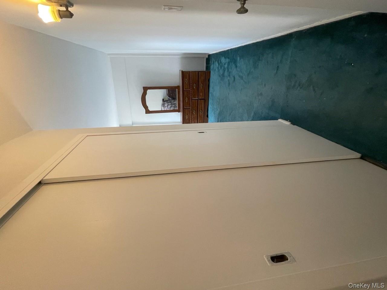 3 Fordham Hill Ovl, Unit 4G Bronx, NY 10468 - Photo 13 of 14 a view of a hallway with wooden floor