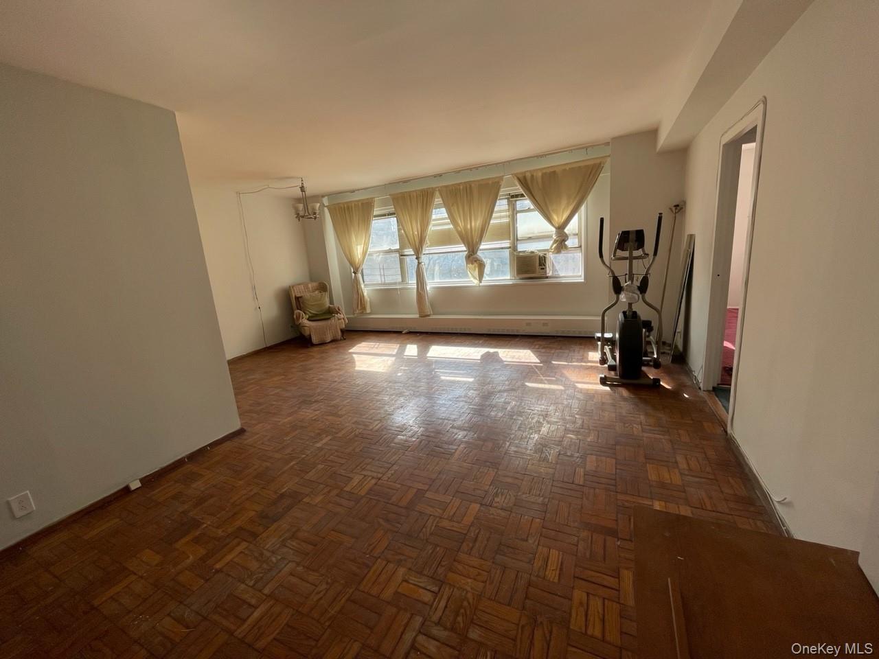 3 Fordham Hill Ovl, Unit 4G Bronx, NY 10468 - Photo 2 of 14 an empty room with windows