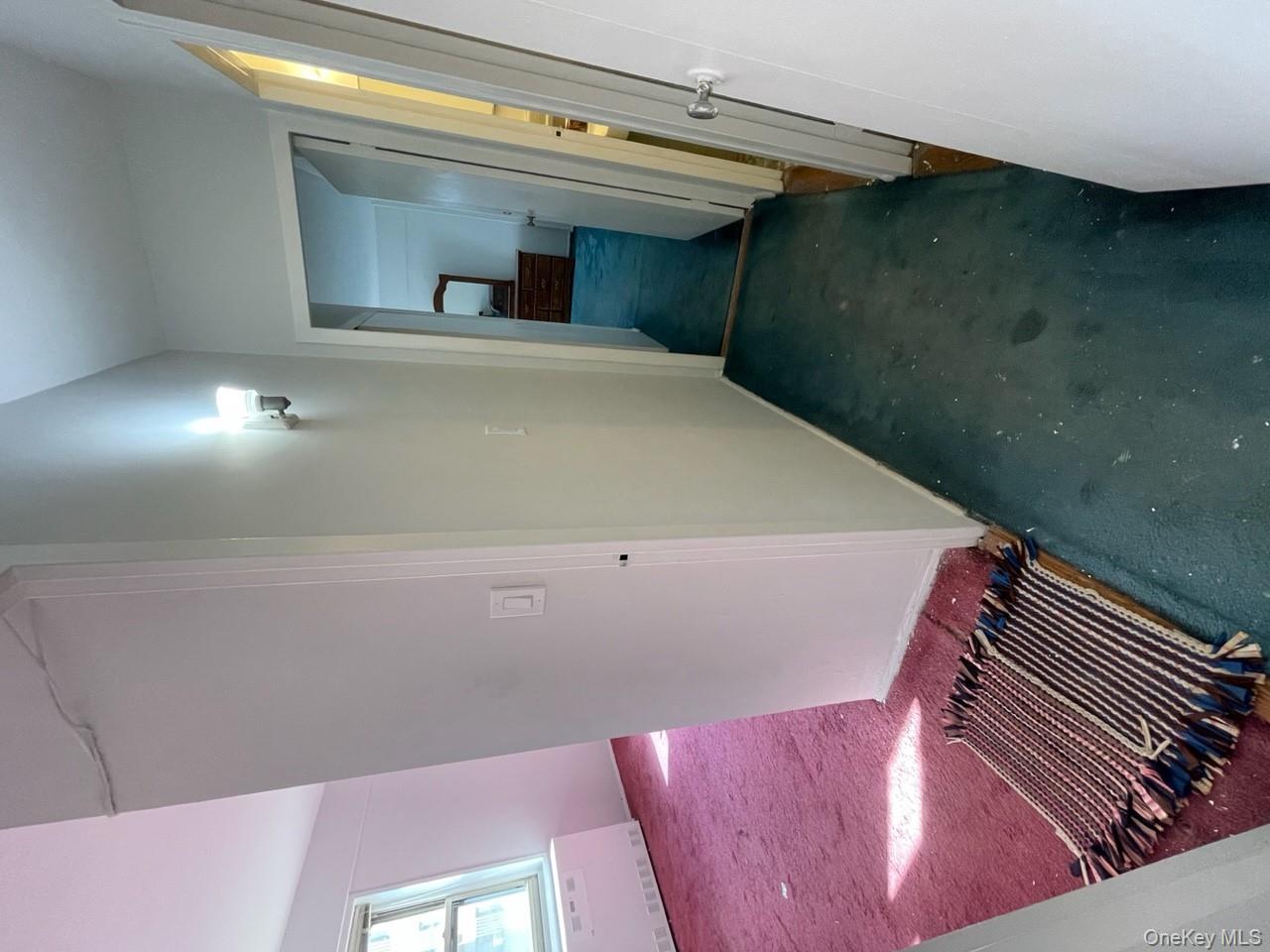 3 Fordham Hill Ovl, Unit 4G Bronx, NY 10468 - Photo 8 of 14 a view of a room with wooden floor and a bathroom