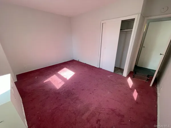 an empty room with closet