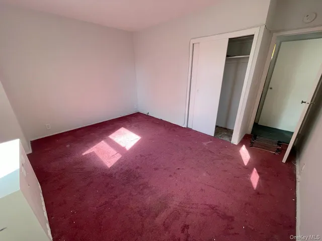 an empty room with closet