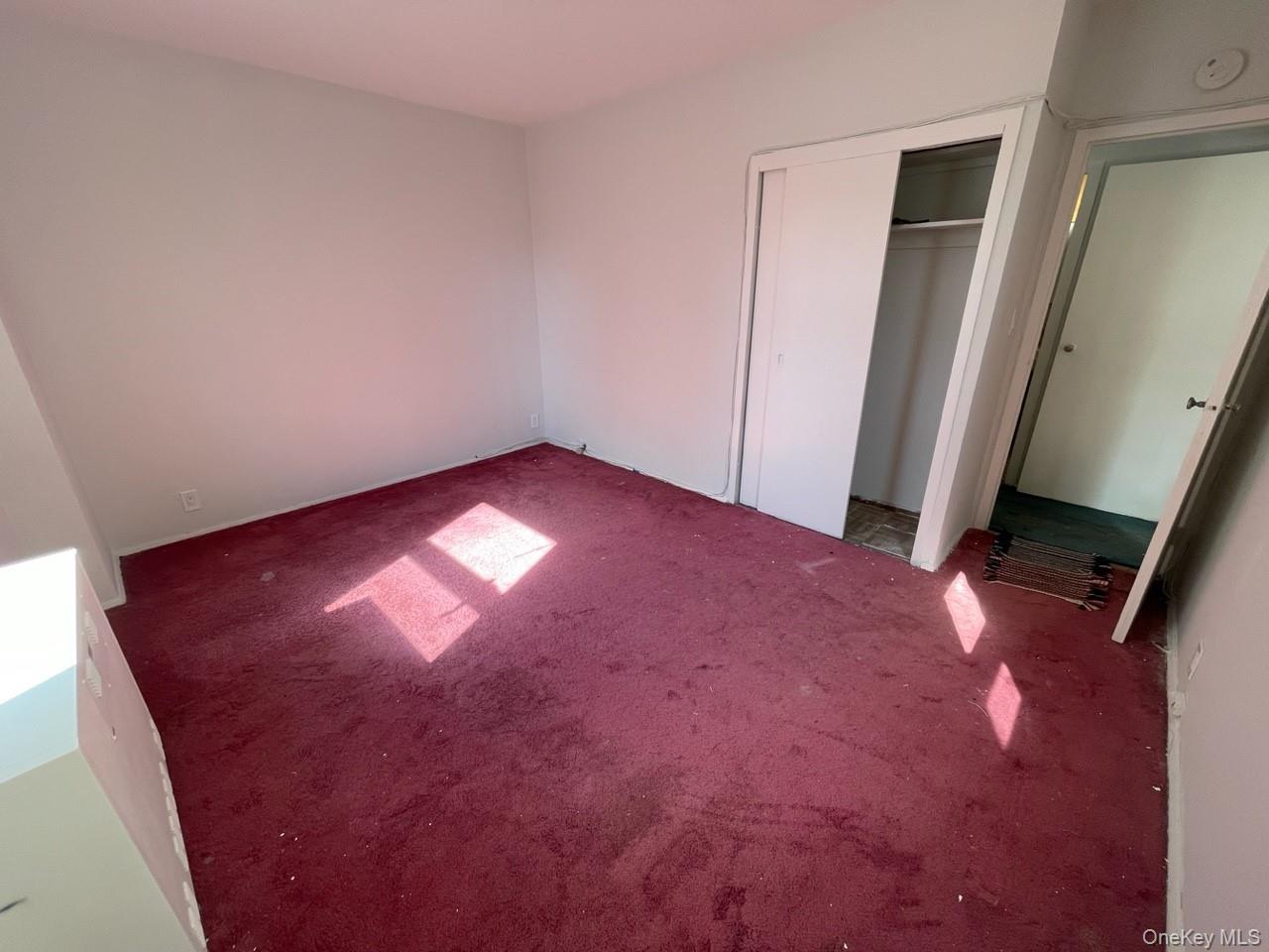 3 Fordham Hill Ovl, Unit 4G Bronx, NY 10468 - Photo 10 of 14 an empty room with closet