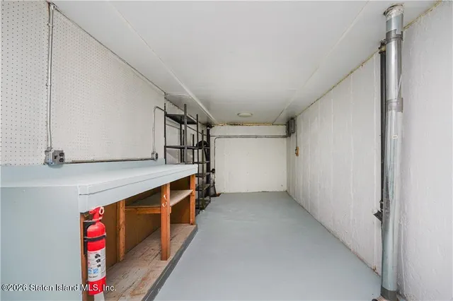 a view of an empty room with stairs