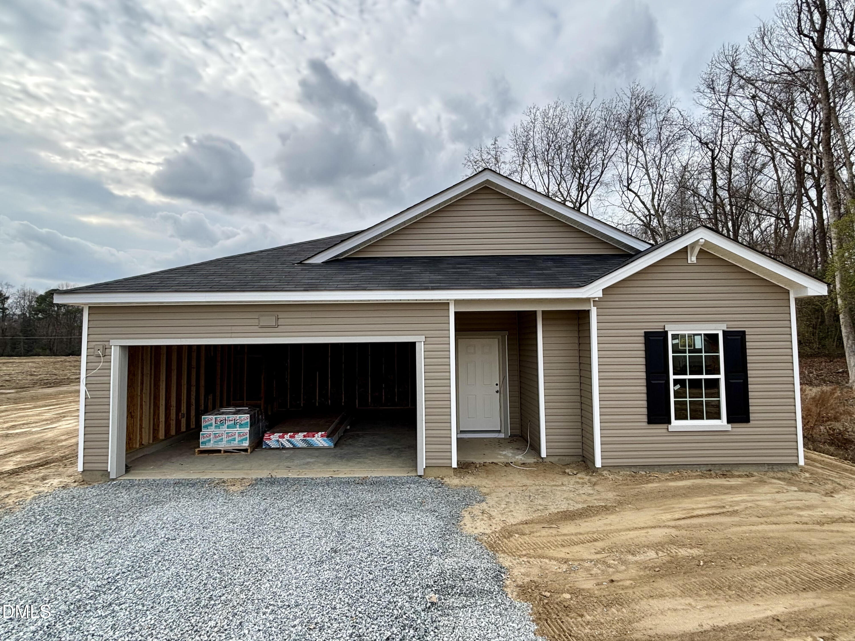 a view of a house with a yard and garage