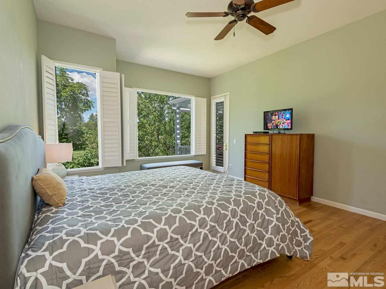 1755 Caughlin Creek Road Reno, NV 89519 - Photo 14 of 25 a bedroom with a bed and a window