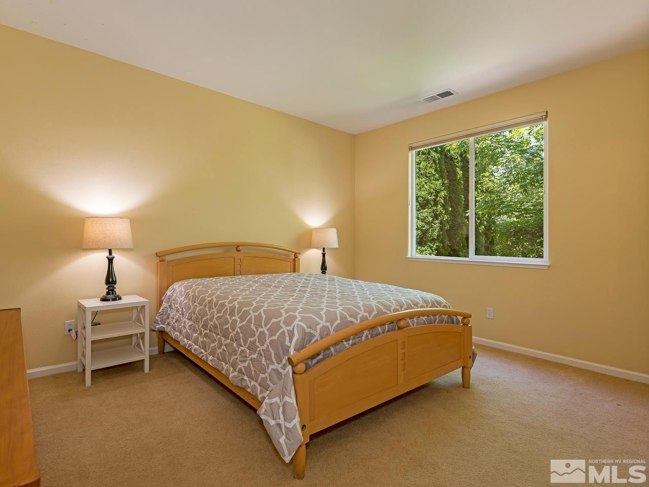 1755 Caughlin Creek Road Reno, NV 89519 - Photo 15 of 25 a bedroom with a bed and a window