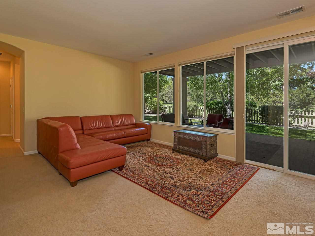1755 Caughlin Creek Road Reno, NV 89519 - Photo 18 of 25 a living room with furniture and a rug