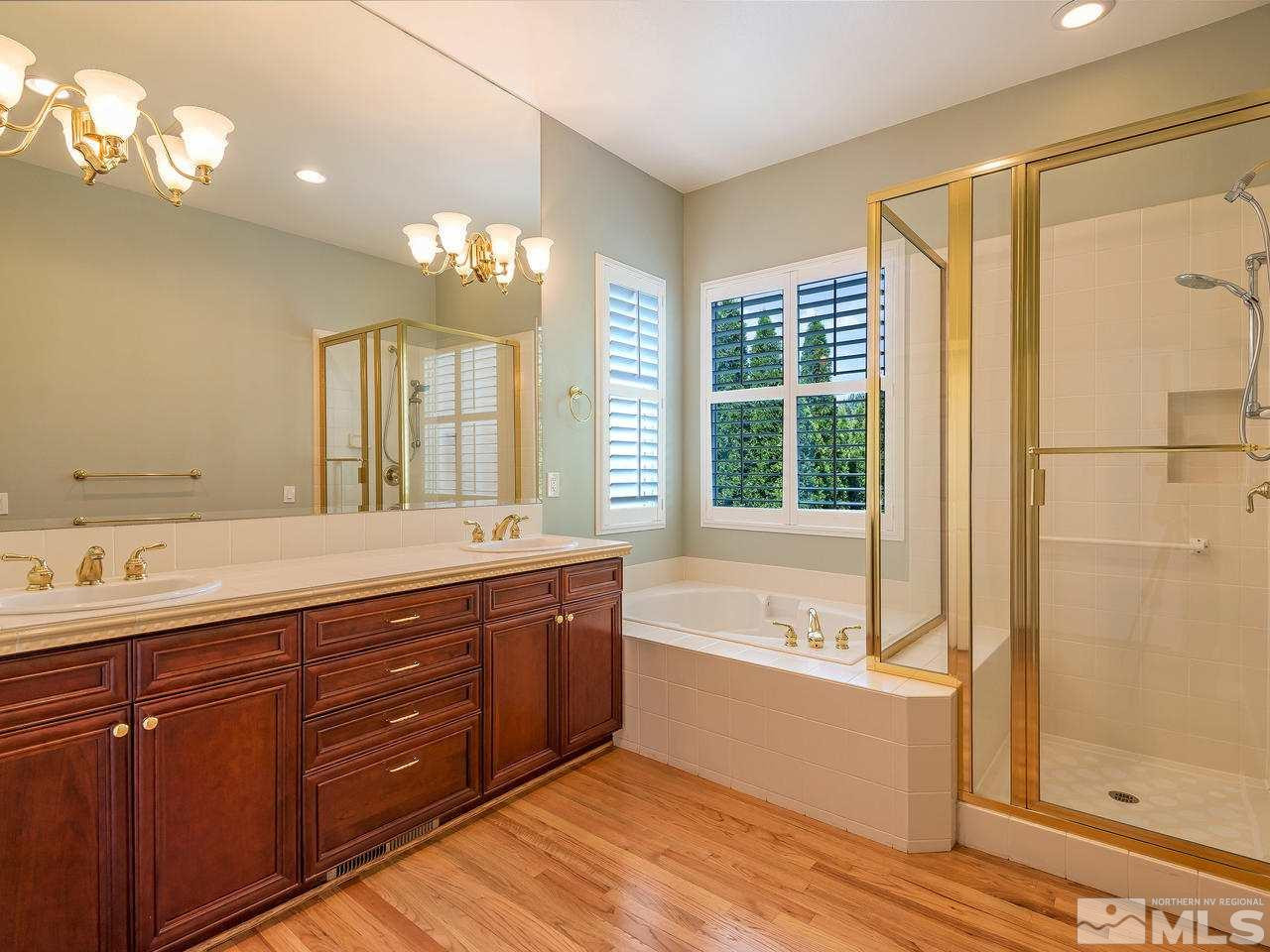 1755 Caughlin Creek Road Reno, NV 89519 - Photo 19 of 25 a spacious bathroom with a tub sink and mirror