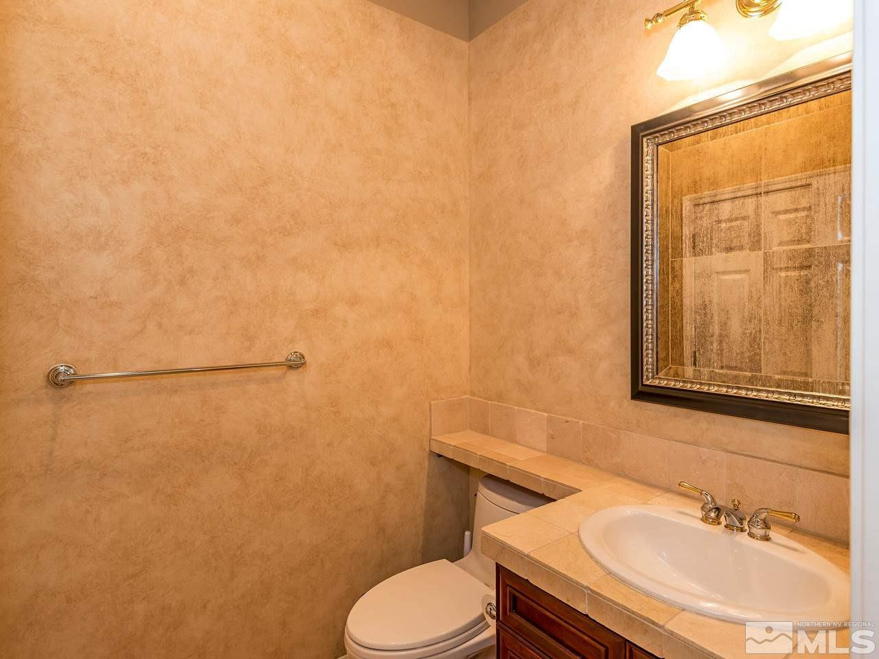 1755 Caughlin Creek Road Reno, NV 89519 - Photo 20 of 25 a bathroom with a sink toilet and shower