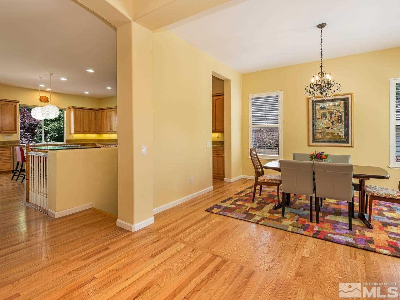 1755 Caughlin Creek Road Reno, NV 89519 - Photo 3 of 25 a view of a dining room with furniture window and wooden floor