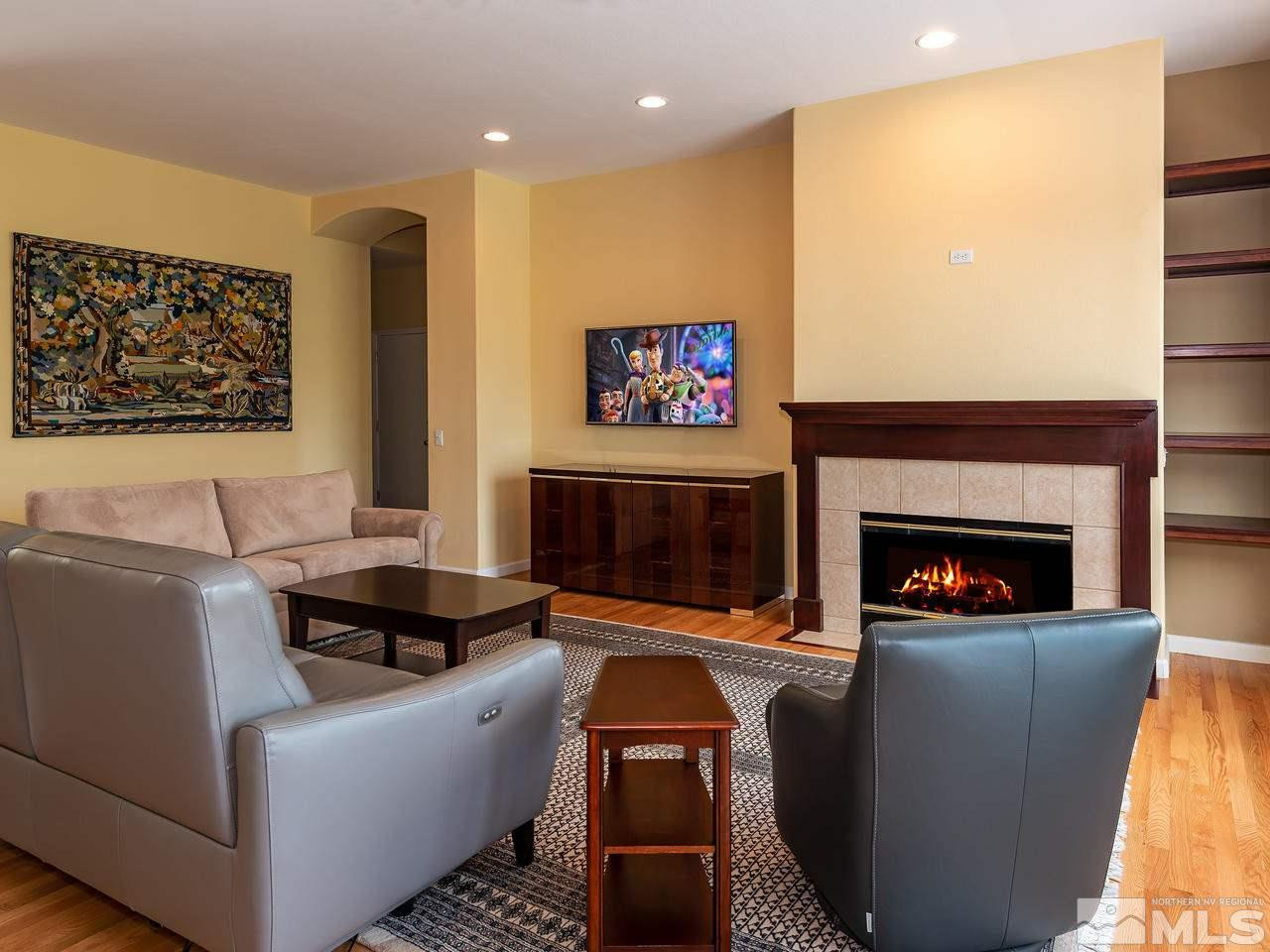 1755 Caughlin Creek Road Reno, NV 89519 - Photo 8 of 25 a living room with furniture and a fireplace