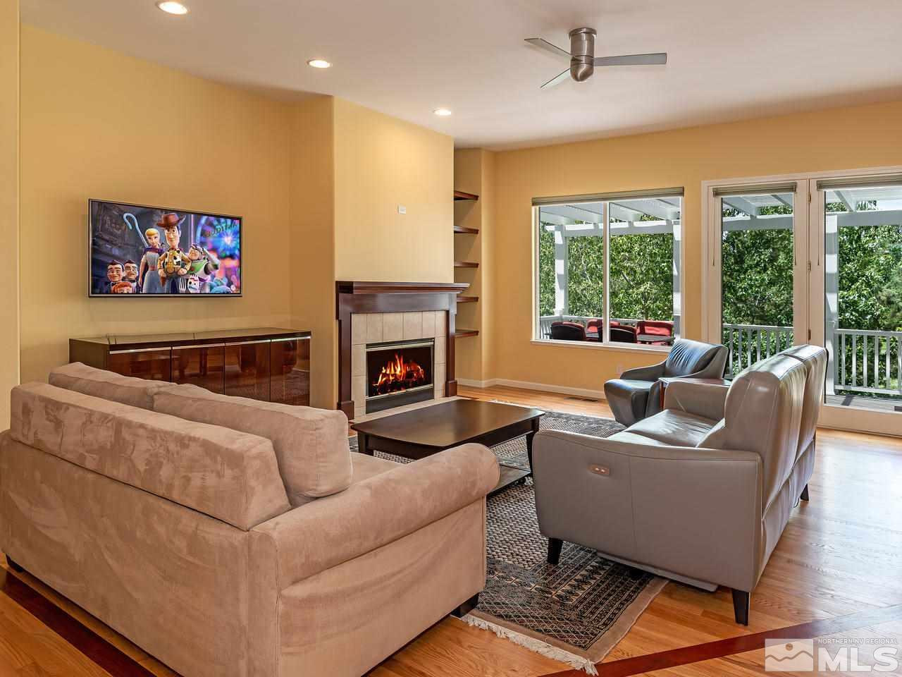 1755 Caughlin Creek Road Reno, NV 89519 - Photo 9 of 25 a living room with furniture and a fireplace