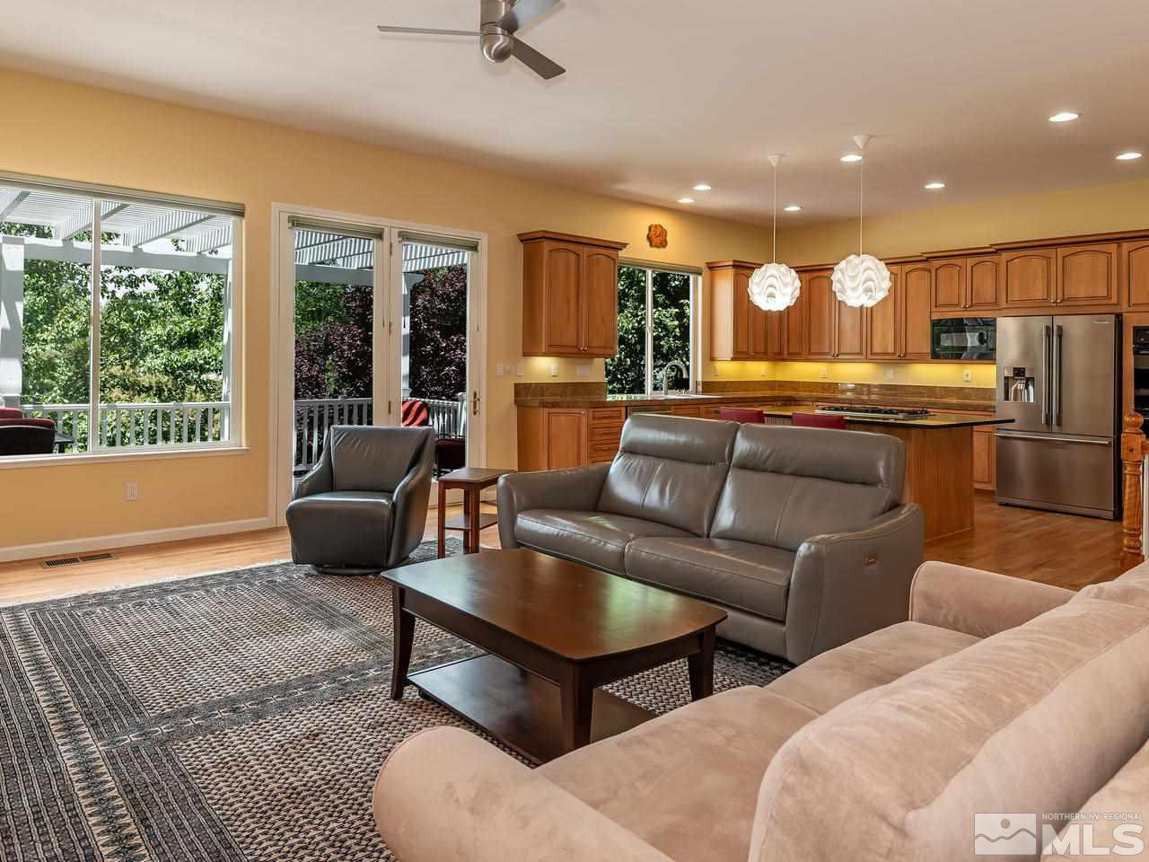 1755 Caughlin Creek Road Reno, NV 89519 - Photo 10 of 25 a living room with furniture and a large window