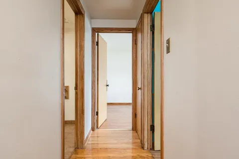 a view of a bathroom from a hallway