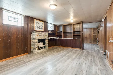 a view of a livingroom with furniture and a fireplace