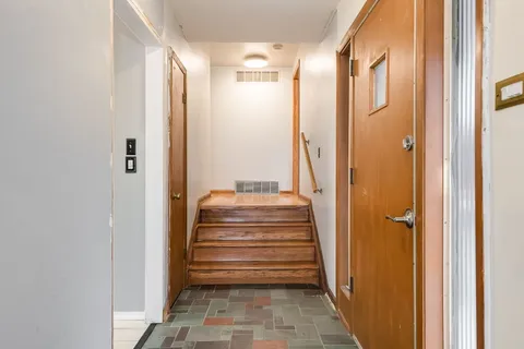a view of a bathroom with shower and bathtub