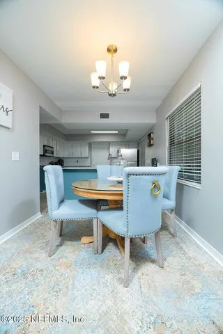 a bathroom with a granite countertop toilet and a sink