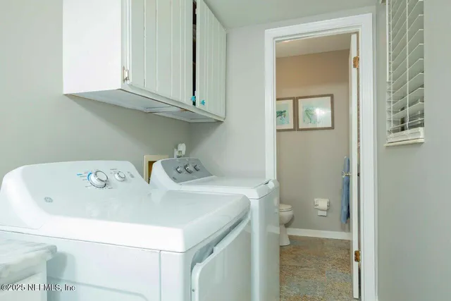 a bedroom with a bed and a view of kitchen
