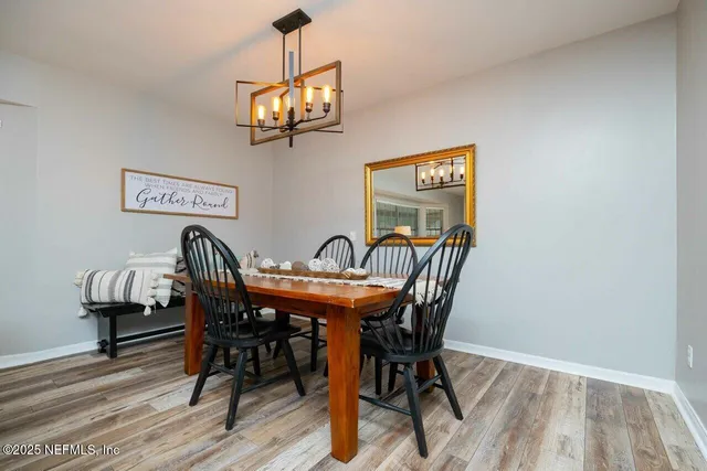 a bath tub sitting next to a white sink and a shower