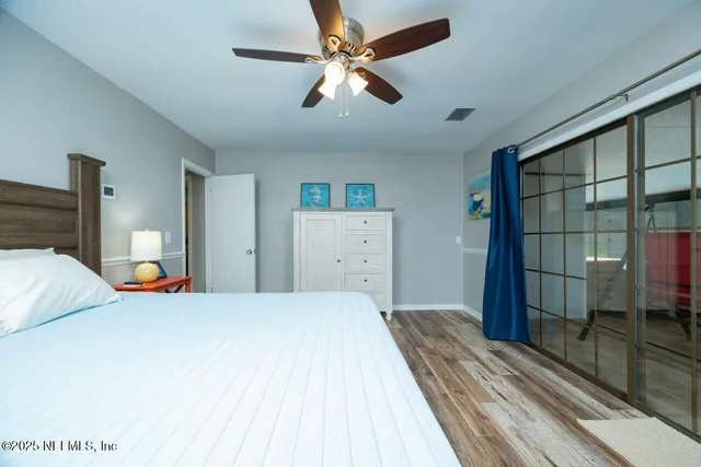 a bathroom with a granite countertop mirror and a sink